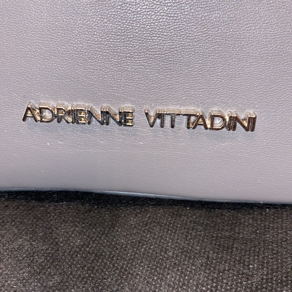 Purse with bow design on front. Brand new with tag. Gray purse. - Picture 6 of 16